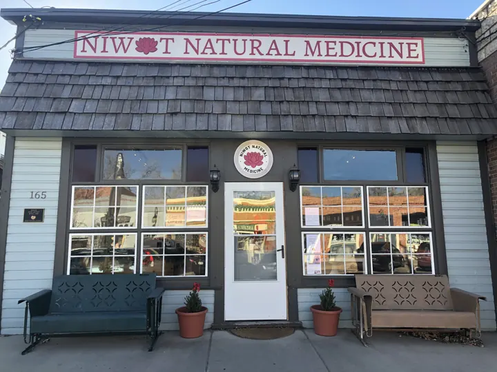 The Niwot Natural Medicine storefront on 2nd Avenue, with benches out front